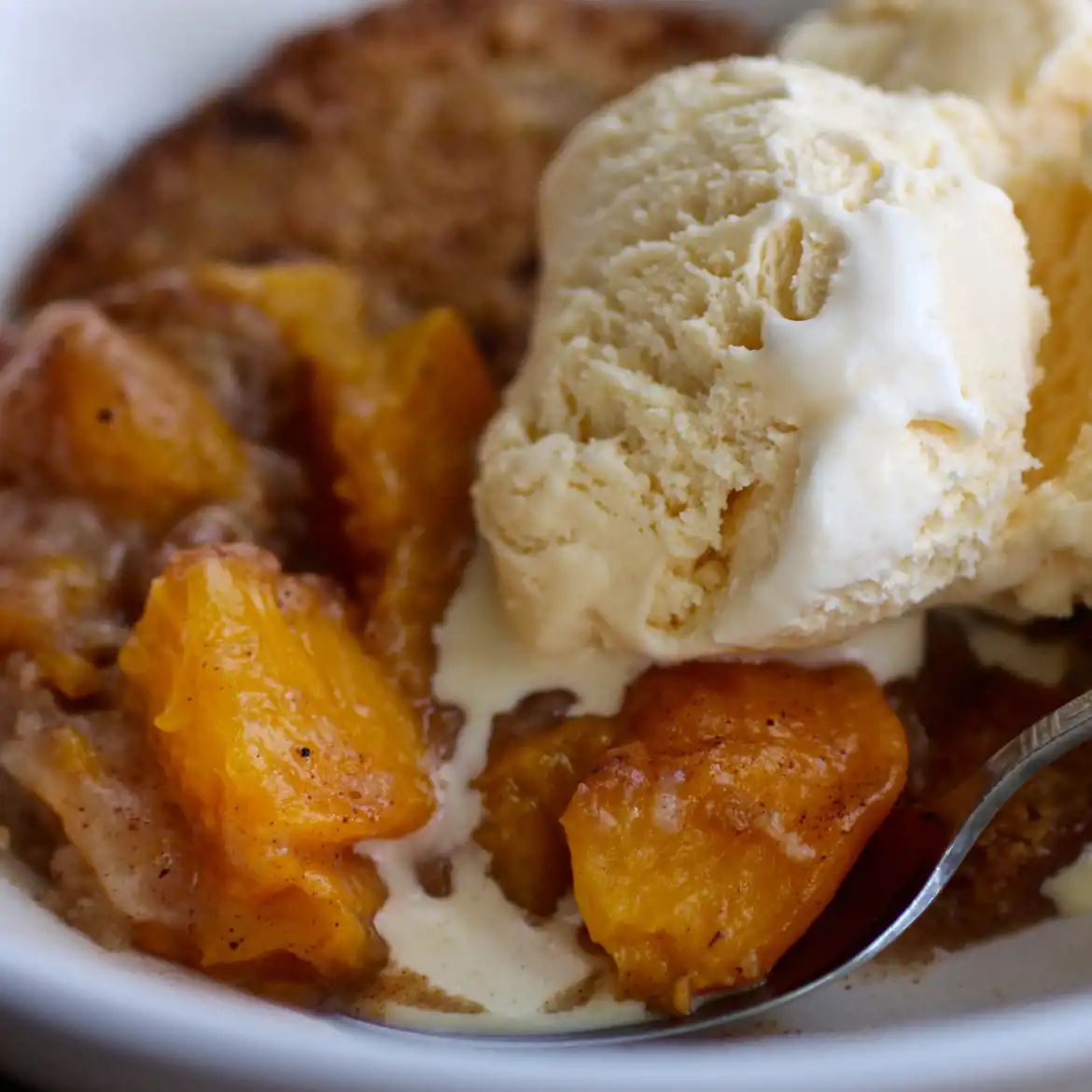 Fresh Peach Cobbler with Vanilla Ice Cream.